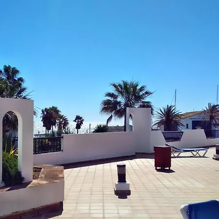 Mikonos Playa: Beachfront Retreat With Marina Access
